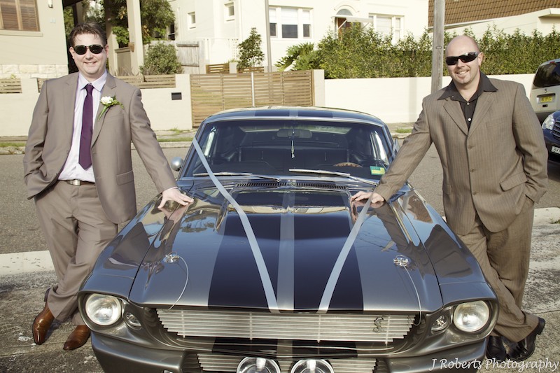 Groom and best man leaning on GT500 - wedding photography sydney
